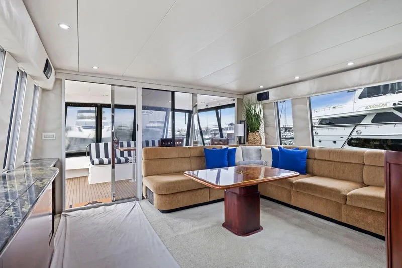 Slide: The Image of Luxurious interior of 1998 Pacific Mariner 65 yacht with plush seating and elegant decor. - 8