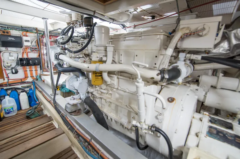 Slide: The Image of Engine room of a 1995 Grand Banks 42 Classic yacht, showcasing detailed machinery. - 39