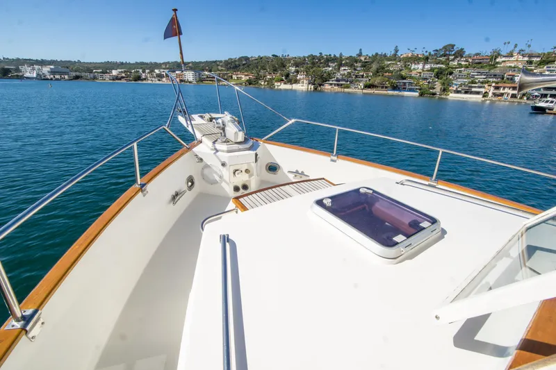 Slide: The Image of Grand Banks 42 Classic 1995 yacht deck with scenic waterfront view. - 9