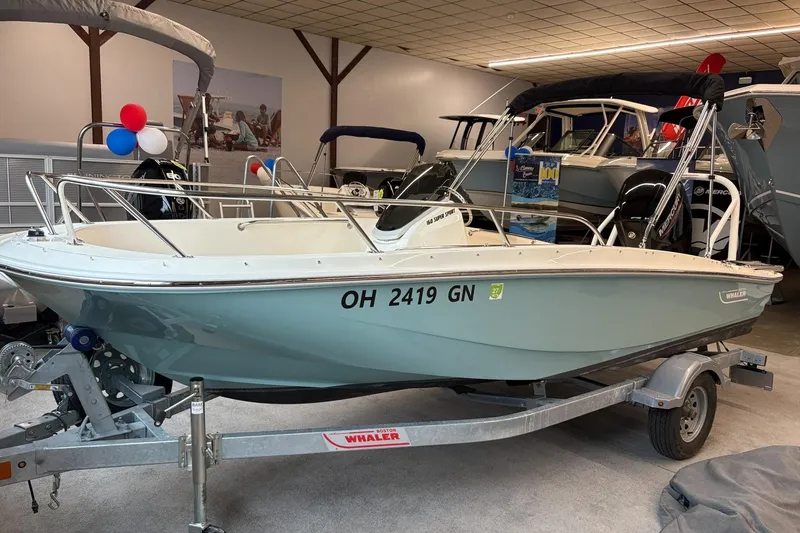 The Image of 2025 Boston Whaler 160 Super Sport boat on trailer in showroom. - 0