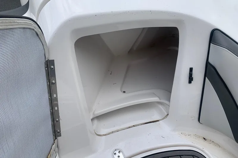 Slide: The Image of Storage compartment in a 2019 Yamaha AR240 boat, open and empty. - 15
