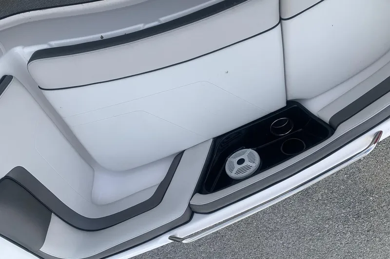 Slide: The Image of 2019 Yamaha AR240 boat interior with cup holders and speaker. - 17