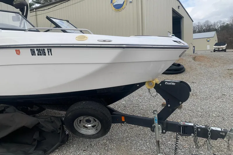 Slide: The Image of 2019 Yamaha Boats AR240 on trailer, parked outside a storage facility. - 2
