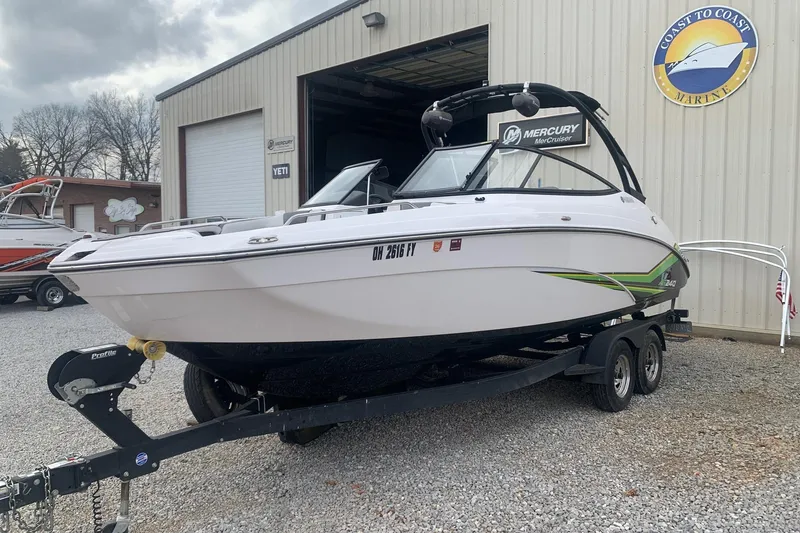 Slide: The Image of 2019 Yamaha AR240 boat on trailer outside Coast to Coast Marine building. - 3