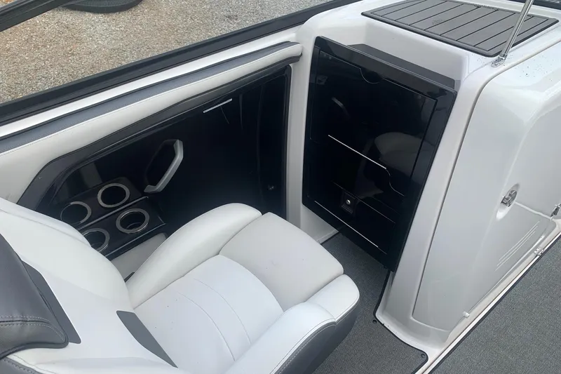 Slide: The Image of 2019 Yamaha Boats AR240 interior with seating and storage compartments. - 6
