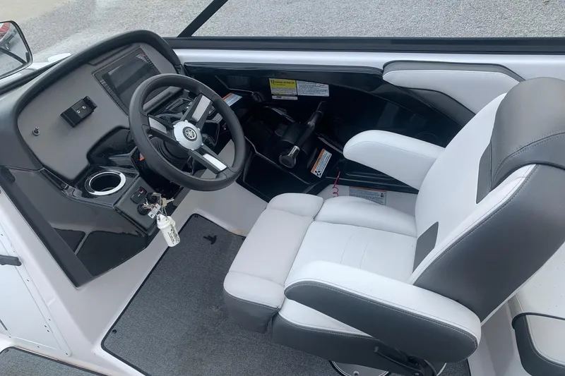 Slide: The Image of 2019 Yamaha Boats AR240 cockpit with steering wheel and captain's chair. - 8