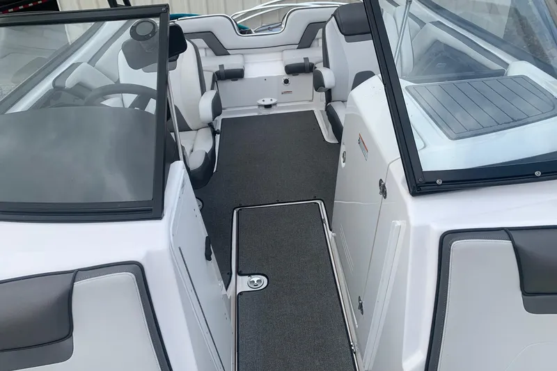 Slide: The Image of 2019 Yamaha Boats AR240 interior with seating and dashboard view. - 9