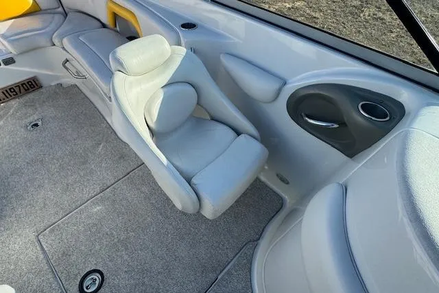 Slide: The Image of Interior of 2006 Crownline 270 BR boat with gray seating and carpet. - 13