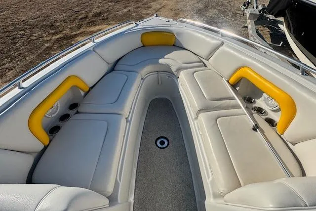 Slide: The Image of 2006 Crownline 270 BR boat interior with white and yellow seating. - 18