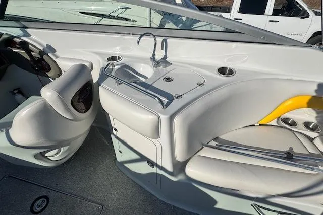 Slide: The Image of 2006 Crownline 270 BR boat interior with sink and seating area. - 20