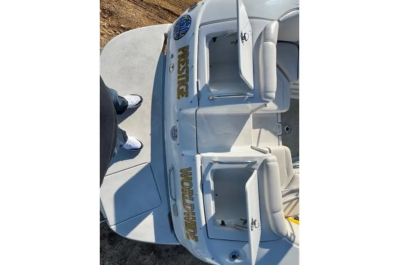 Slide: The Image of 2006 Crownline 270 BR boat with "Prestige Worldwide" text on deck, viewed from above. - 9