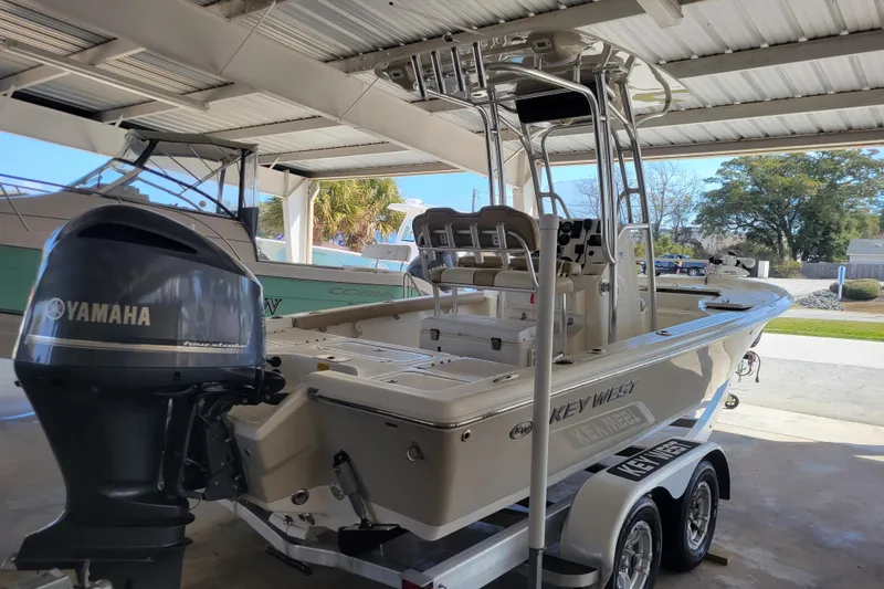 The Image of 2018 Key West 230 Bay Reef boat with Yamaha engine in covered storage. - 0