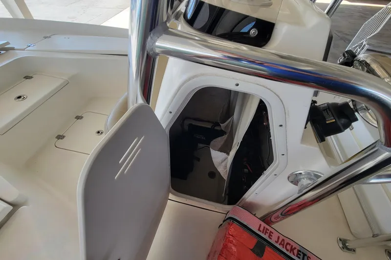 Slide: The Image of 2018 Key West 230 Bay Reef boat interior with storage and life jackets. - 3