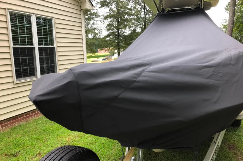 Slide: The Image of 2018 Key West 230 Bay Reef boat console with steering wheel and navigation equipment. - 5