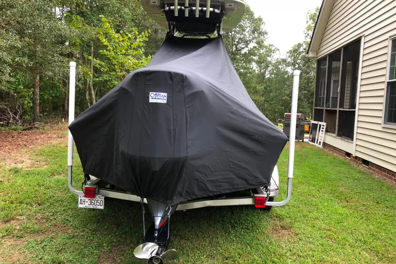 Slide: The Image of 2018 Key West 230 Bay Reef boat interior with console and seating under shelter. - 6