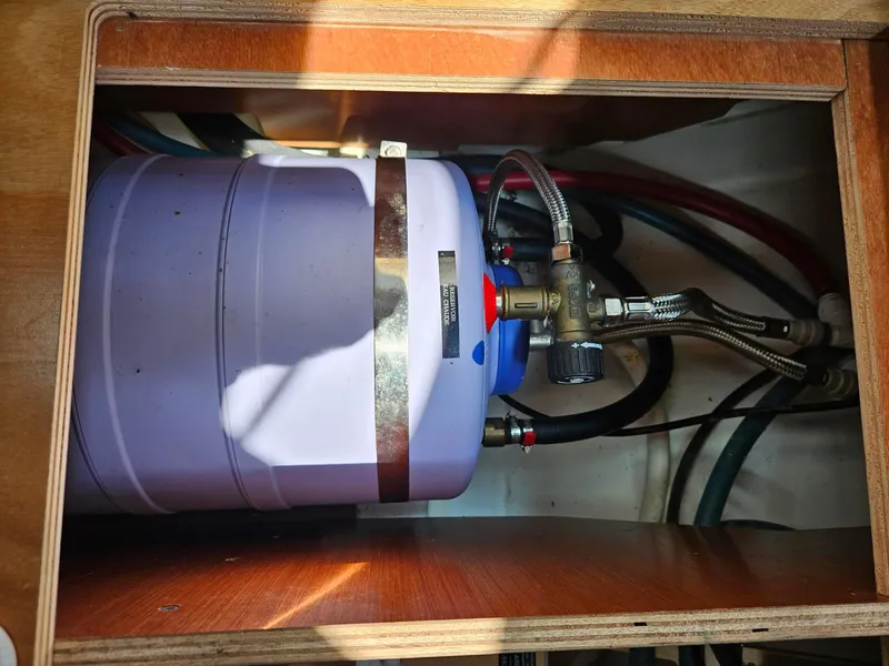 Slide: The Image of Water heater system inside 2012 Beneteau Oceanis 37 yacht, featuring pipes and connections. - 27
