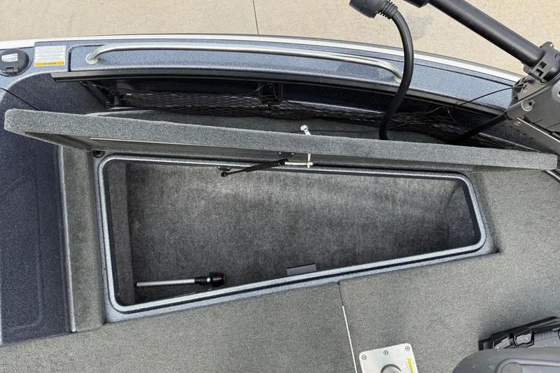 Slide: The Image of 2015 Lund 202 Pro-V GL boat storage compartment open, showcasing interior space. - 12