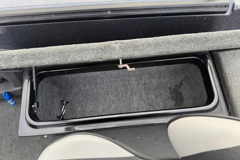 Slide: The Image of Open storage compartment in 2015 Lund 202 Pro-V GL boat interior. - 28