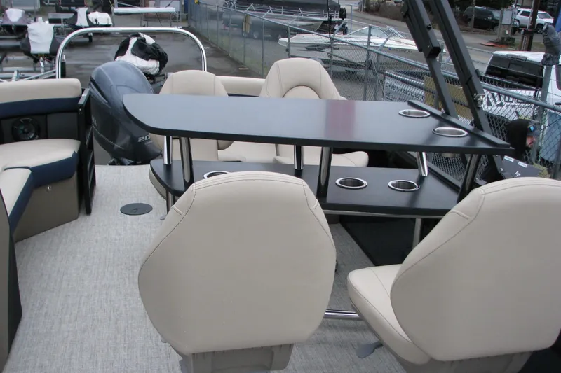 Slide: The Image of 2026 Berkshire 24 E CTS pontoon boat interior with seating and table setup. - 10