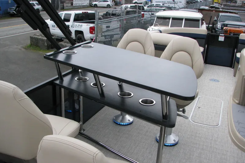 Slide: The Image of 2026 Berkshire 24 E CTS boat interior with table and seating arrangement. - 12