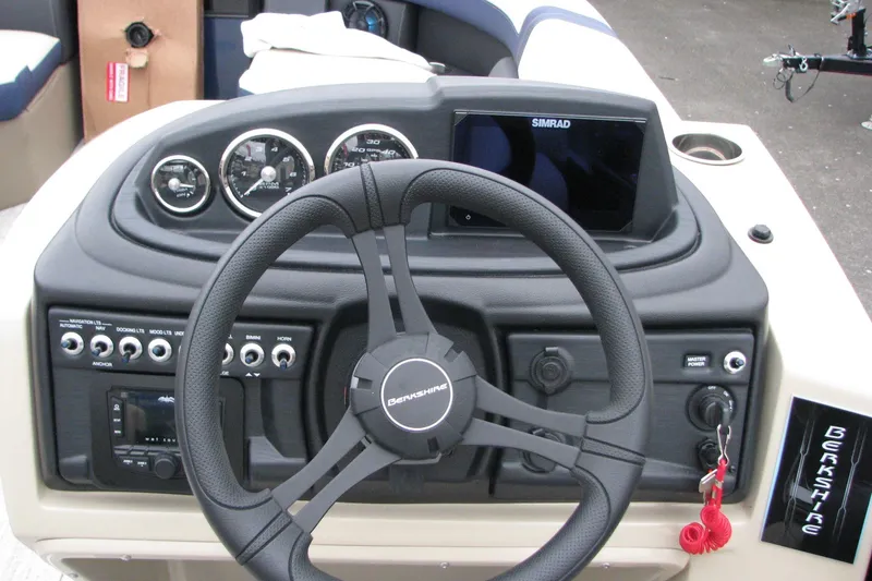 Slide: The Image of Steering console of 2026 Berkshire 24 E CTS boat with Simrad display and controls. - 4