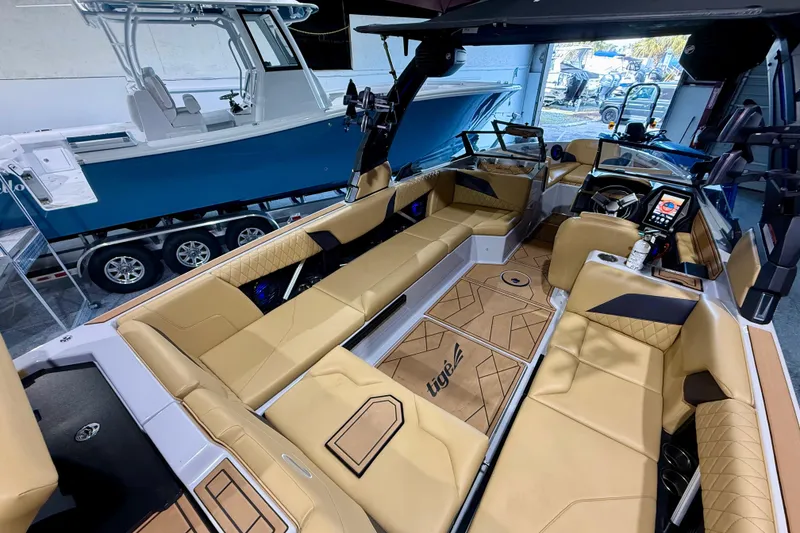 Slide: The Image of Luxurious interior of 2023 Tigé Z5 boat with tan leather seating and modern dashboard. - 12