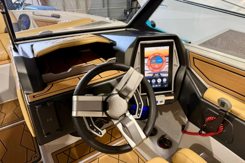 Slide: The Image of 2023 Tigé Z5 boat dashboard with touchscreen and modern steering wheel. - 18