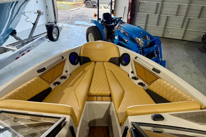 Slide: The Image of 2023 Tigé Z5 boat interior with tan leather seating and modern design. - 21
