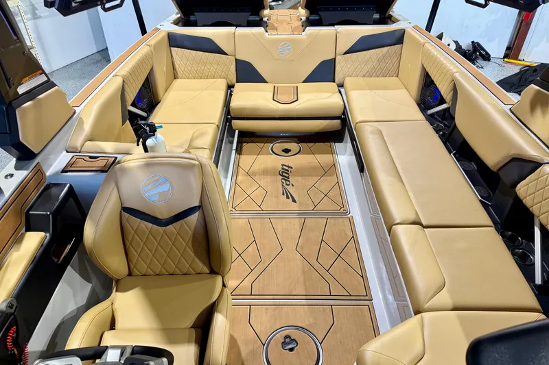 Slide: The Image of Luxurious interior of 2023 Tigé Z5 boat with tan leather seating and stylish wood flooring. - 23
