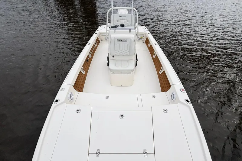 Slide: The Image of 2023 Pathfinder 2500 Hybrid boat on water, showcasing spacious deck and seating. - 17