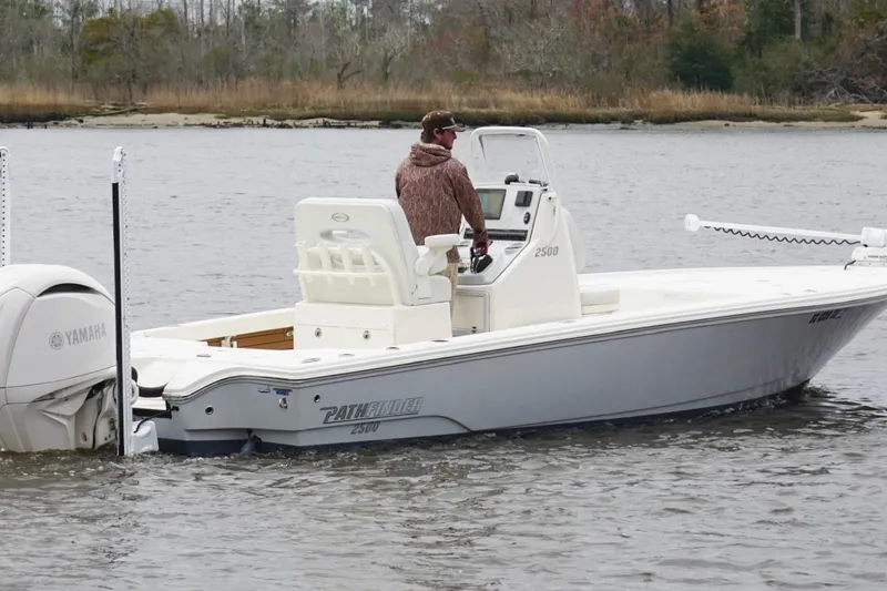 Slide: The Image of 2023 Pathfinder 2500 Hybrid boat on water, featuring Yamaha engine. - 8