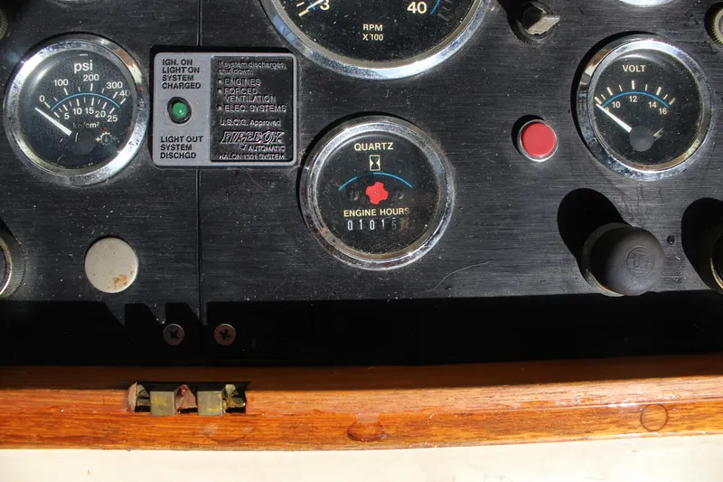 Slide: The Image of Control panel of a 1985 Ventura South Bay Flybridge Sedan Sport boat, showing gauges and switches. - 17