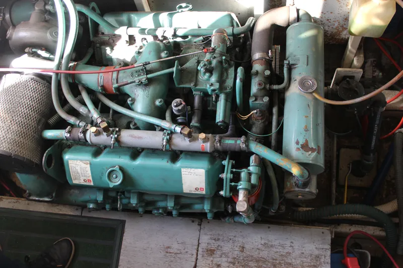 Slide: The Image of Engine of 1985 Ventura South Bay Flybridge Sedan Sport boat, showing detailed components. - 25