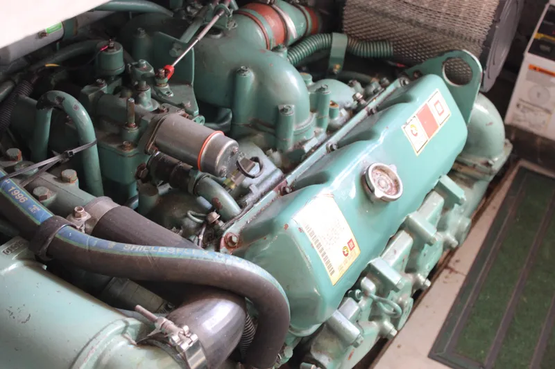 Slide: The Image of Engine of 1985 Ventura South Bay Flybridge Sedan Sport boat, detailed view. - 26