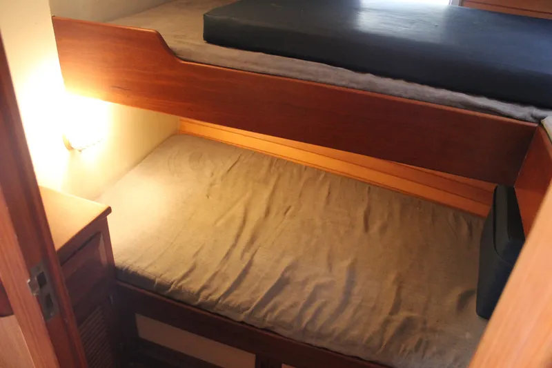 Slide: The Image of Cozy bunk beds in 1985 Ventura South Bay Flybridge Sedan Sport yacht cabin. - 9