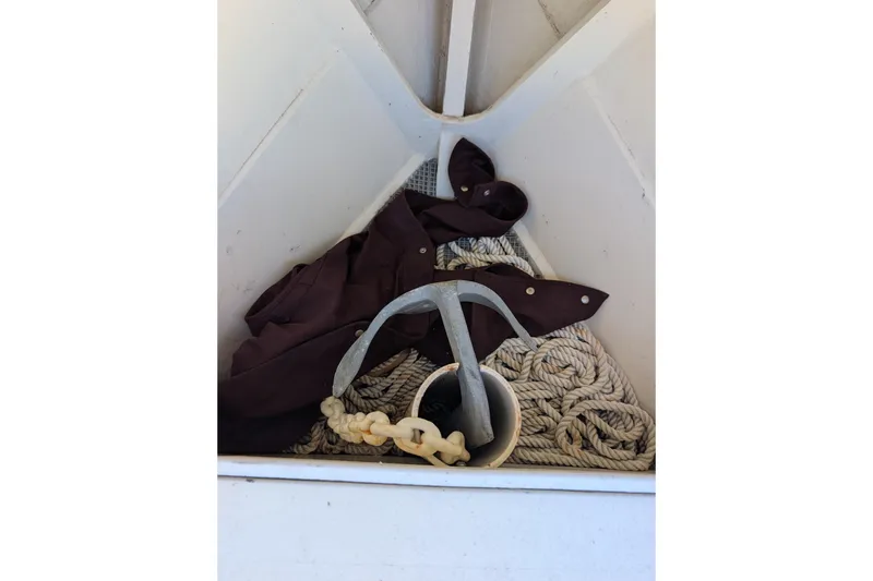 Slide: The Image of Anchor and rope in a 1998 Belkov skiff storage compartment. - 18