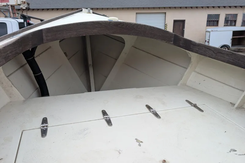 Slide: The Image of 1998 Belkov skiff interior with wooden trim and storage compartment. - 30