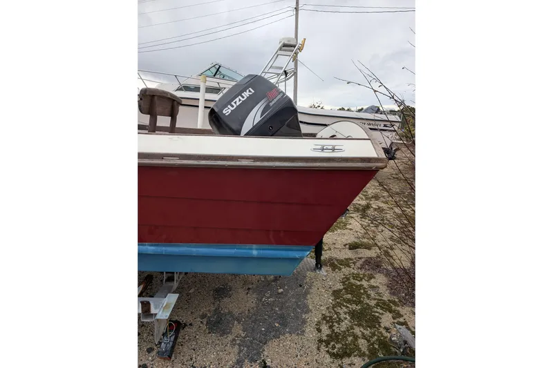 Slide: The Image of 1998 Belkov skiff with Suzuki outboard motor on a trailer. - 33