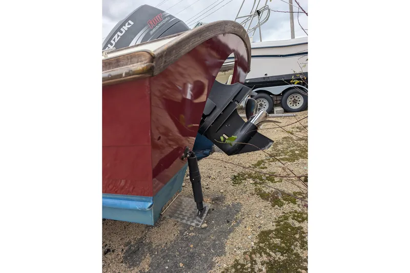 Slide: The Image of 1998 Belkov skiff with Suzuki outboard motor on a trailer. - 35