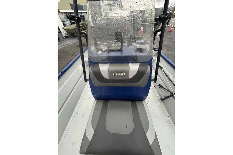 Slide: The Image of 2024 Lund 2070 Predator CC boat interior with console and seating. - 8