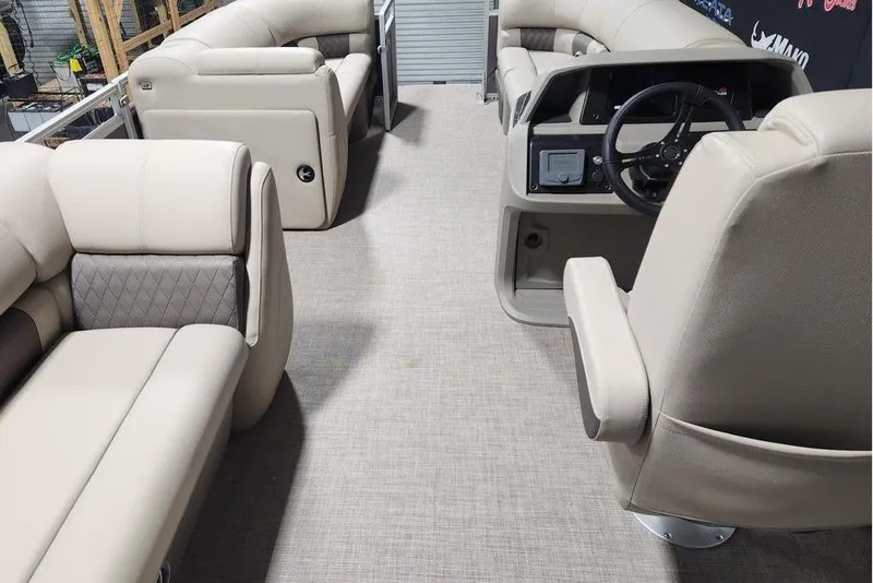 Slide: The Image of 2025 Sun Tracker Party Barge 20 DLX interior with plush seating and modern helm. - 6