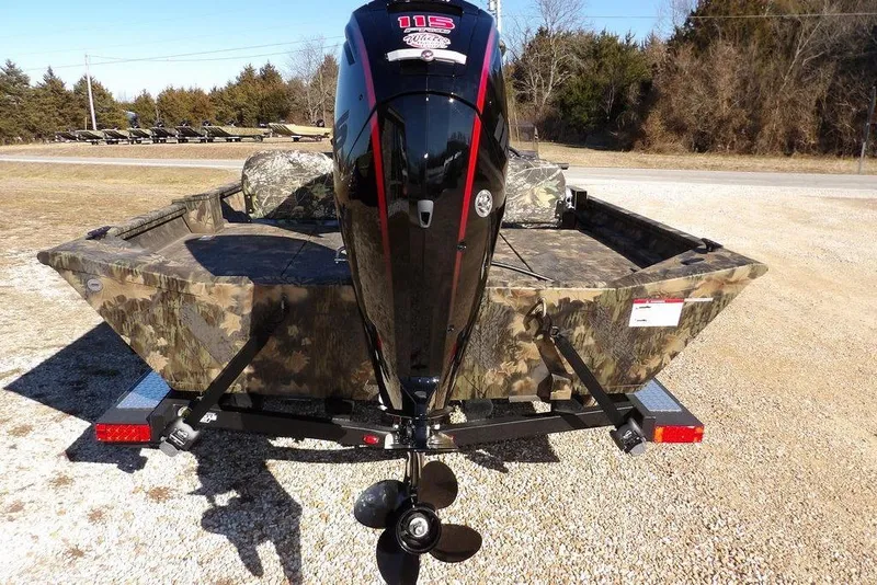 Slide: The Image of 2026 Crestliner 2070 Retriever SCHD boat with camouflage design and powerful outboard motor. - 11