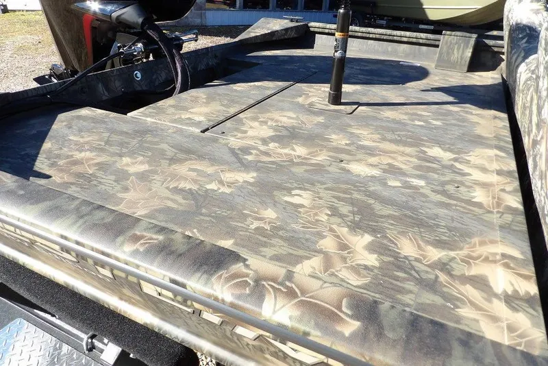 Slide: The Image of 2026 Crestliner 2070 Retriever SCHD boat with camouflage deck design. - 13