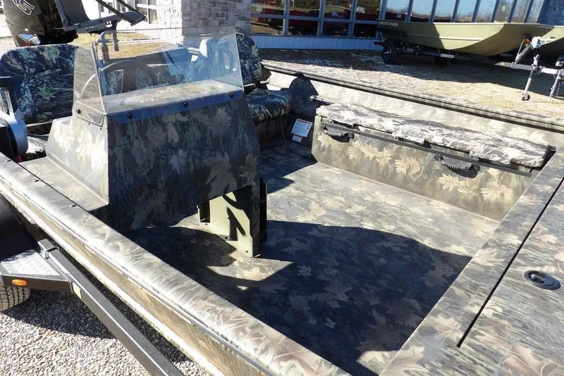 Slide: The Image of 2026 Crestliner 2070 Retriever SCHD boat with camouflage interior and seating. - 15