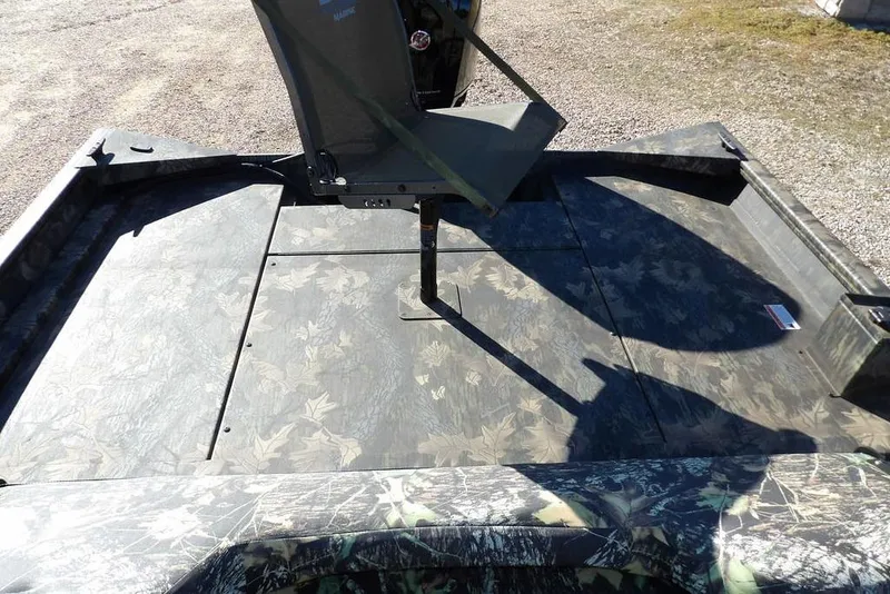 Slide: The Image of 2026 Crestliner 2070 Retriever SCHD boat with camouflage deck and seating. - 17