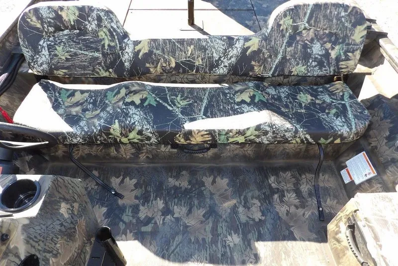 Slide: The Image of 2026 Crestliner 2070 Retriever SCHD boat with camouflage seating and flooring design. - 23