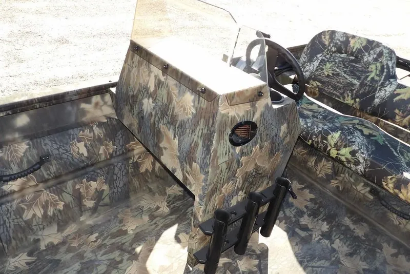 Slide: The Image of Camouflage interior of 2026 Crestliner 2070 Retriever SCHD boat with steering console and seating. - 25
