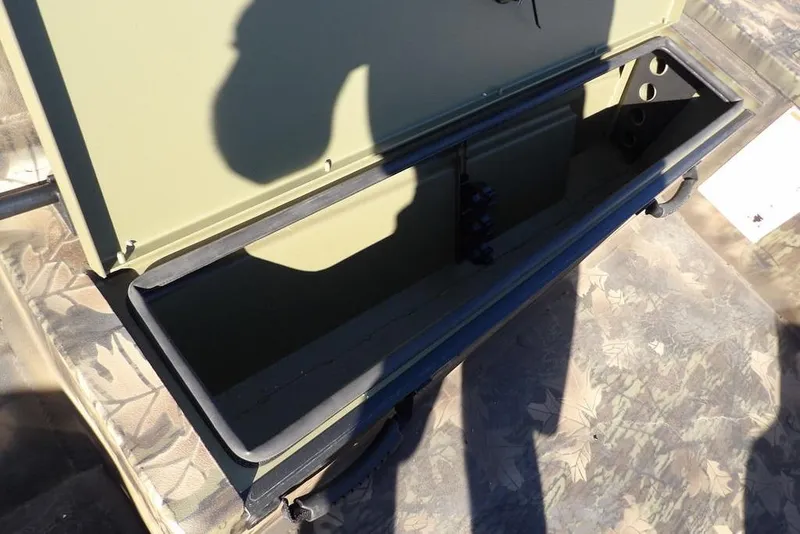 Slide: The Image of Open storage compartment in 2026 Crestliner 2070 Retriever SCHD boat, showing interior details. - 26