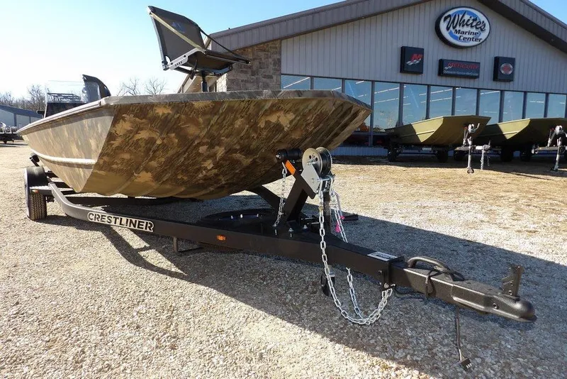 Slide: The Image of 2026 Crestliner 2070 Retriever SCHD boat on trailer at marine center. - 29