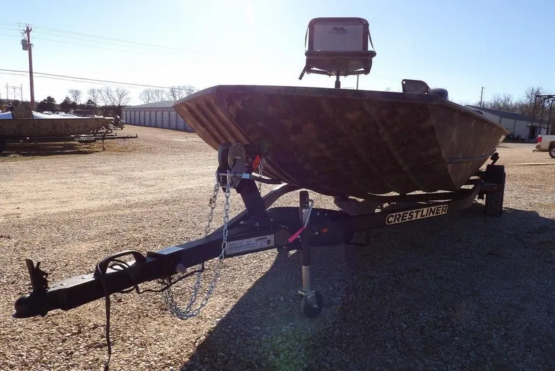 Slide: The Image of 2026 Crestliner 2070 Retriever SCHD boat on trailer in outdoor setting. - 32